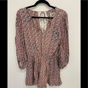 Anthropology romper size small with delicate neckline and tie back